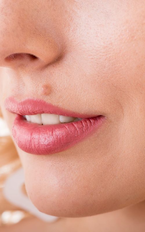 16300383 - part of a woman's face with a mole close-up