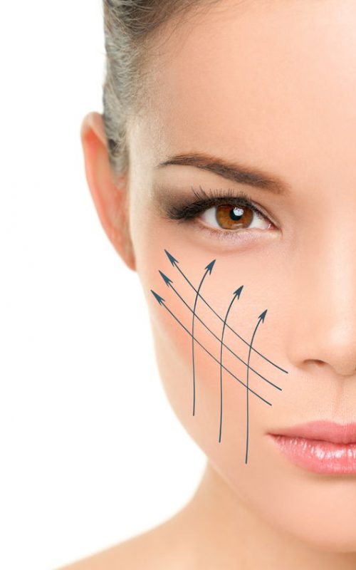 36325126 - face lift anti-aging treatment - asian woman portrait with graphic lines showing facial lifting effect on perfect skin. skincare cosmetic concept.